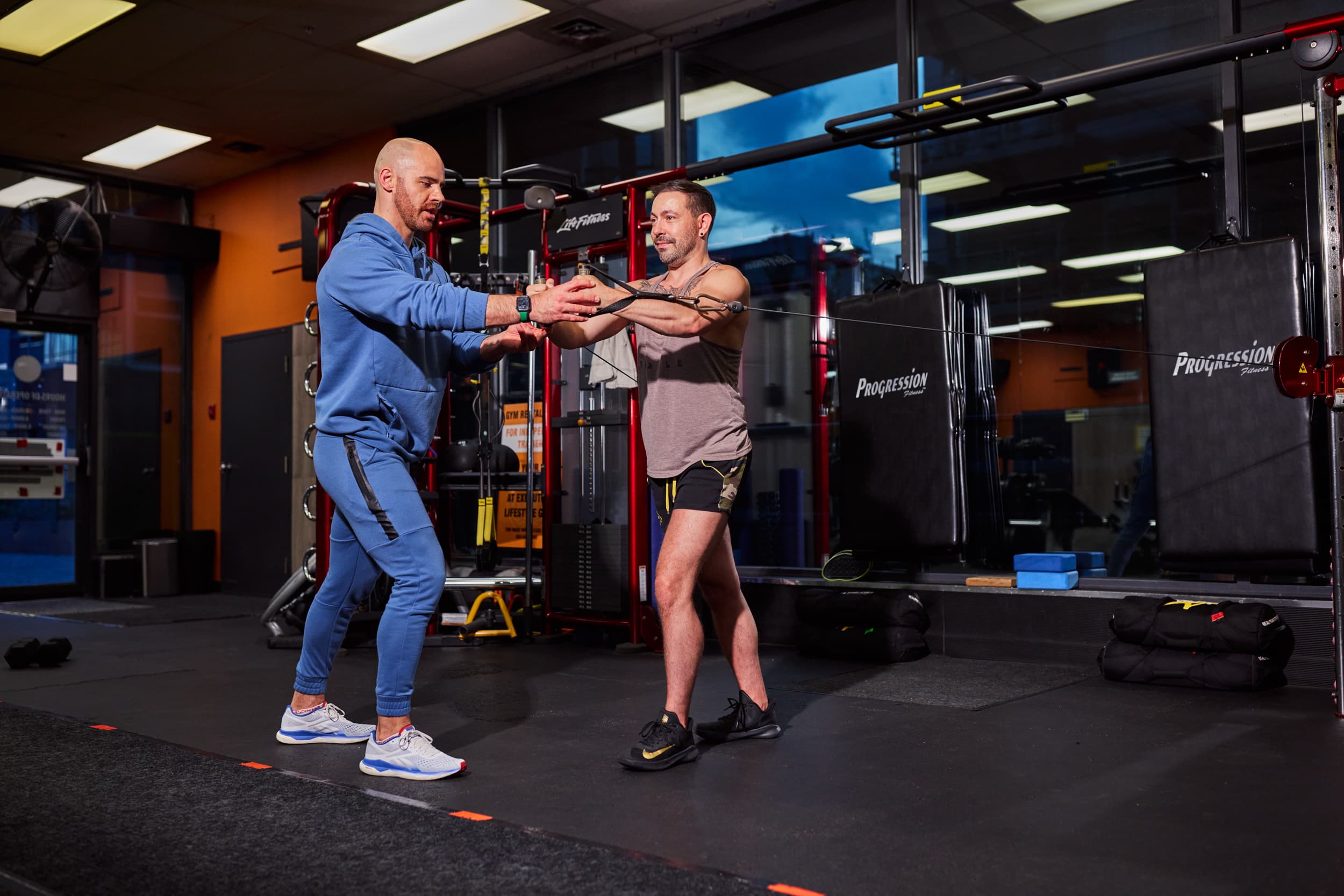 Johnny training client with cable machine